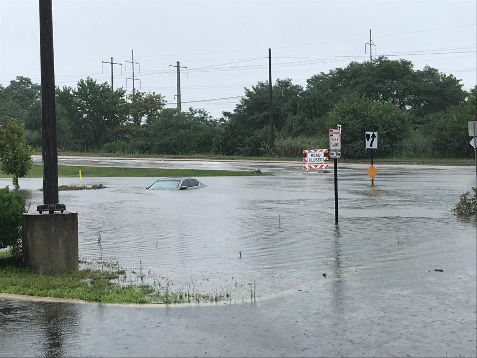 At least two cars were almost completely submerged and others were stuck in water due to flooding on Governor Printz Boulevard near E Lea Boulevard in Edgemoor Tuesday morning. The flooding is due to Topical Storm Isaias.