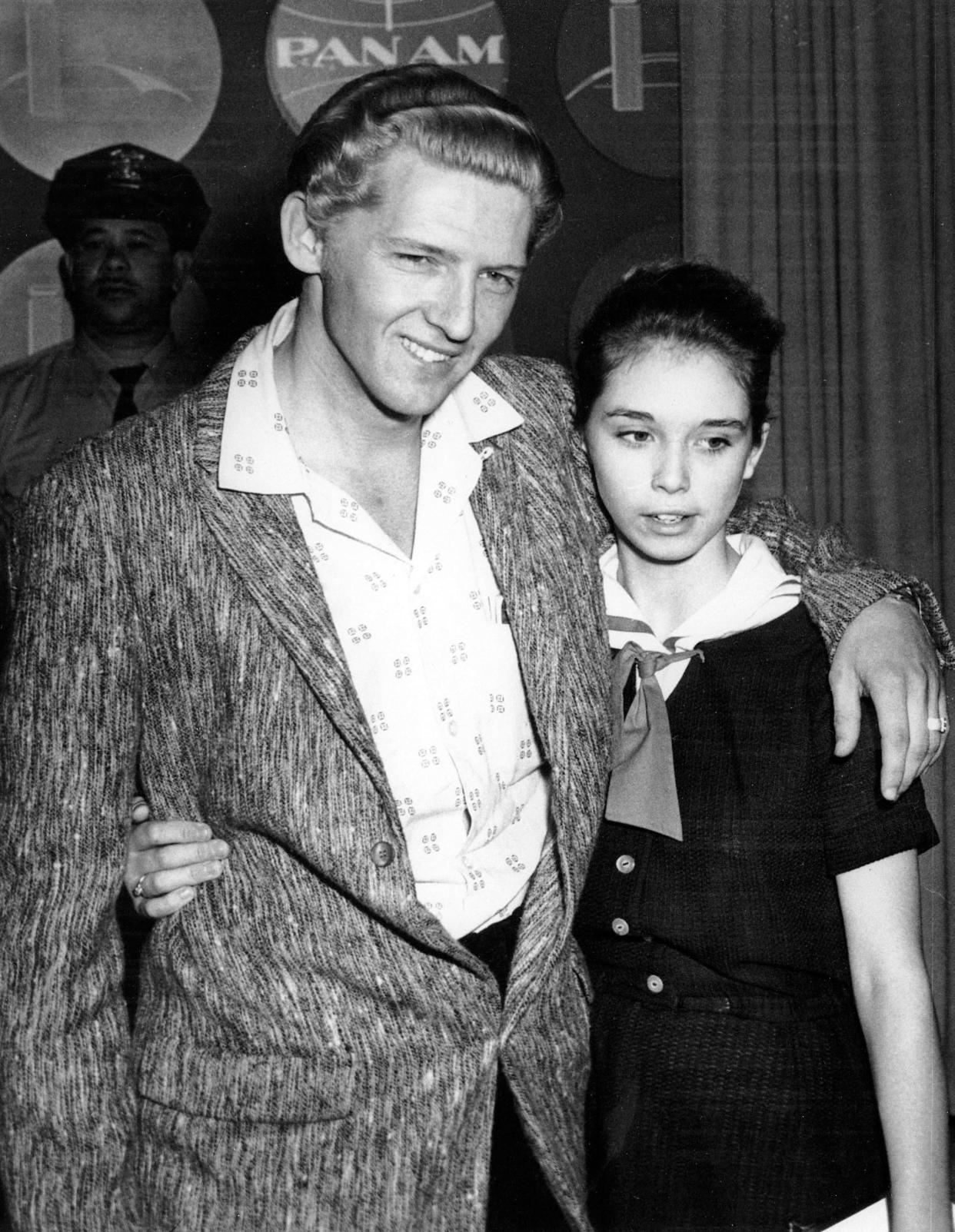 Seen at a London press conference on May 24, 1958 are American Rock 'n' Roll singer Jerry Lee Lewis, 22, and his cousin, Myra Brown, 13, whom he took as his third wife before divorcing his second.