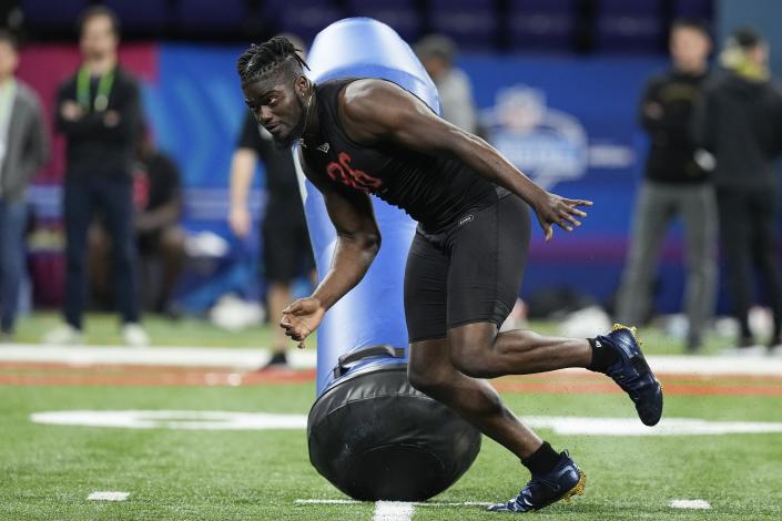 Michigan defensive lineman David Ojabo runs a drill during the NFL football scouting combine Saturday, March 5, 2022, in Indianapolis. (AP Photo/Darron Cummings)