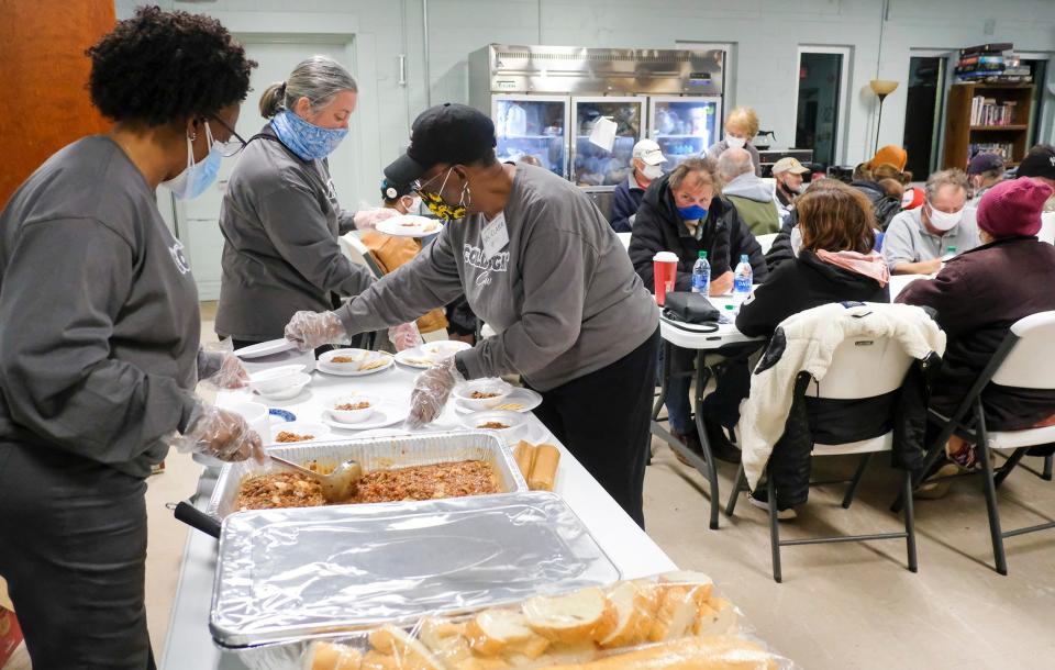 The “cold night crew” volunteers at One Hopeful Place in Fort Walton Beach prepare hot meals for people as temperatures fell sharply over the weekend.