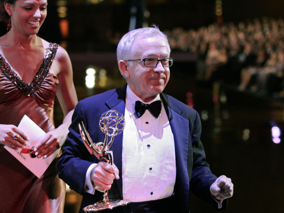 FILE - Leslie Jordan carries his award for outstanding guest actor in a comedy series, for his work on "Will & Grace," off stage during the Creative Arts Emmy Awards on Aug. 19, 2006, in Los Angeles. Jordan, the Emmy-winning actor whose wry Southern drawl and versatility made him a comedy and drama standout on TV series including “Will & Grace” and “American Horror Story,” has died. He was 67. (AP Photo/Chris Carlson, File)