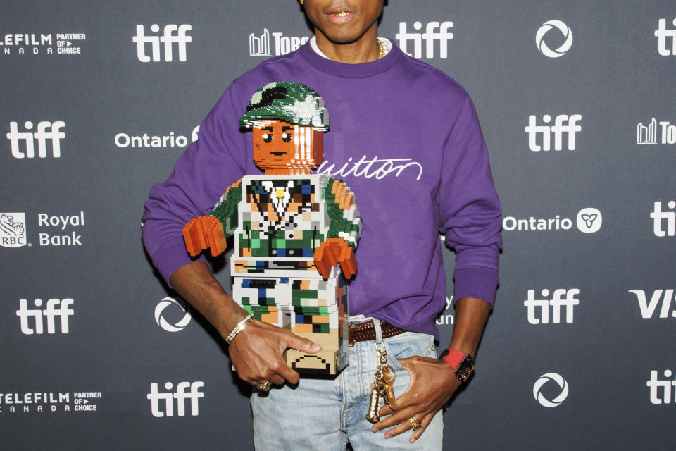 Pharrell Williams arrives on the red carpet for the premiere of 'Piece by Piece' at the Princess of Wales Theatre during the Toronto International Film Festival in Toronto, Tuesday, Sept. 10, 2024. (Cole Burston/The Canadian Press via AP)