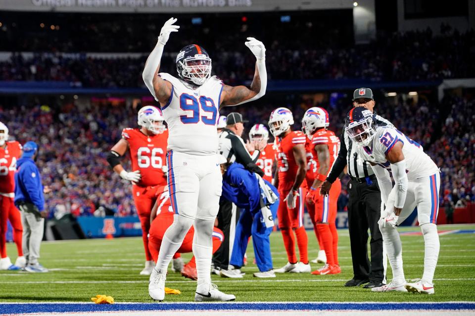 New York Giants defensive end Leonard Williams (99) encourages the crowd to get loud during the second half against the Buffalo Bills at Highmark Stadium.