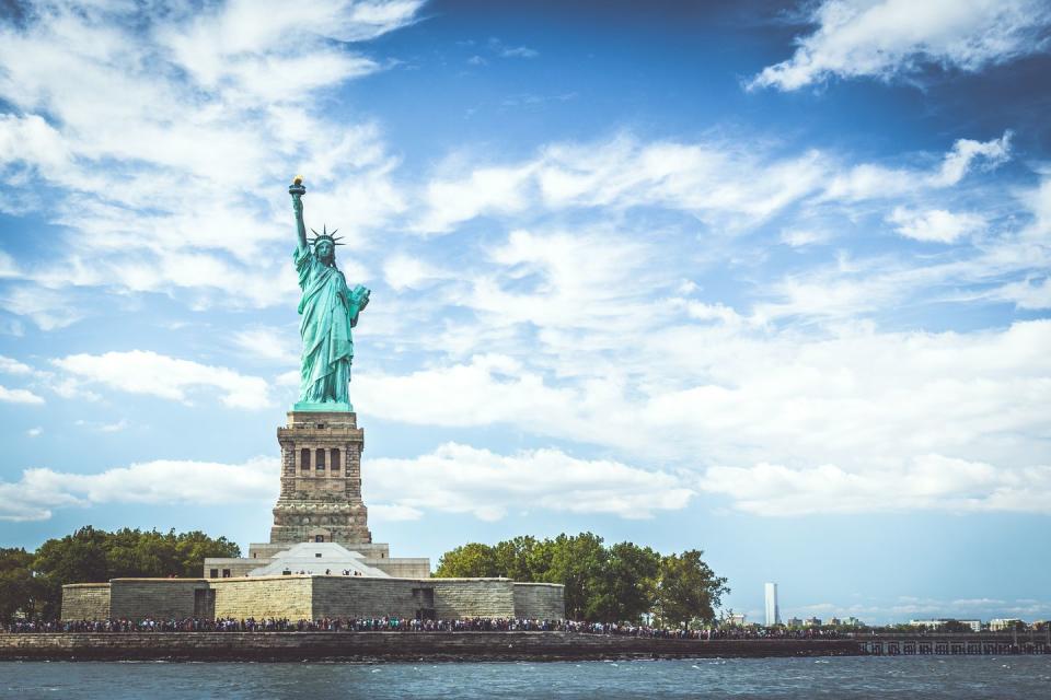 Visit the Statue of Liberty on Ellis Island.