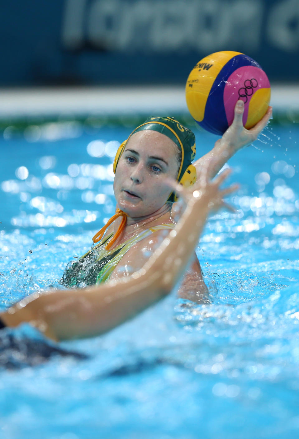 LONDON, ENGLAND - AUGUST 01: Glencora Ralph #9 of Australia passes the ball in the Women's Preliminary Round Water Polo match between Great Britain and Australia on Day 5 of the London 2012 Olympics at Water Polo Arena on August 1, 2012 in London, England. (Photo by Jeff J Mitchell/Getty Images)