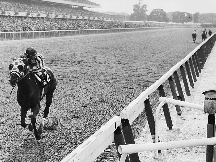 Secretariat approaches the finish line to win the 1973 Belmont Stakes by a record 31 lengths. Many consider the performance to be the greatest ever by a thoroughbred. His Triple Crown was the first in 25 years. (Bob Coglianese/Lexington Herald-Leader/Tribune News Service via Getty Images)