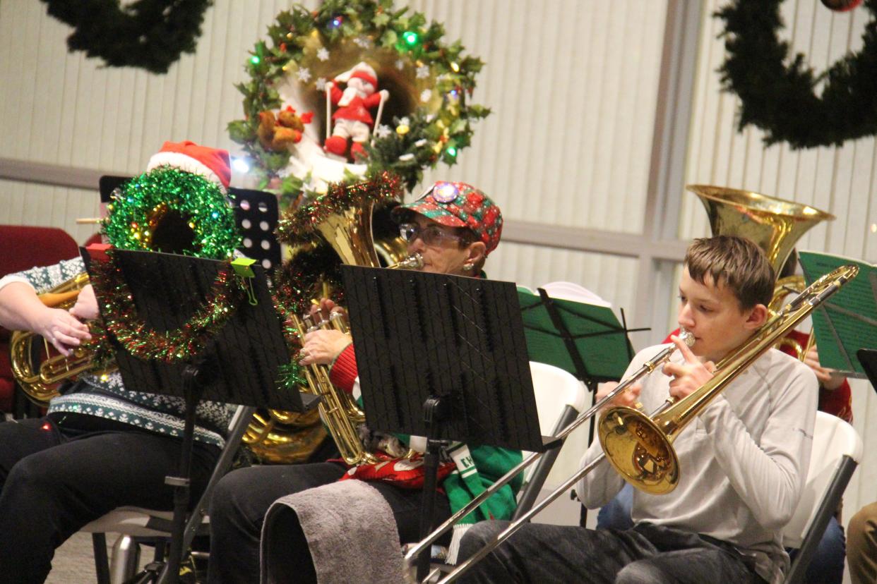 Area low brass players perform during the first TUBACHRISTMAS on Saturday, Dec. 10, 2022, at First United Methodist Church in Perry.