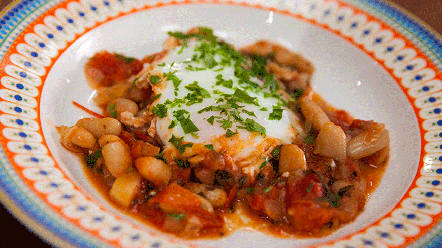 Bakes eggs, cannellini beans and tomato. Photo: Supplied.