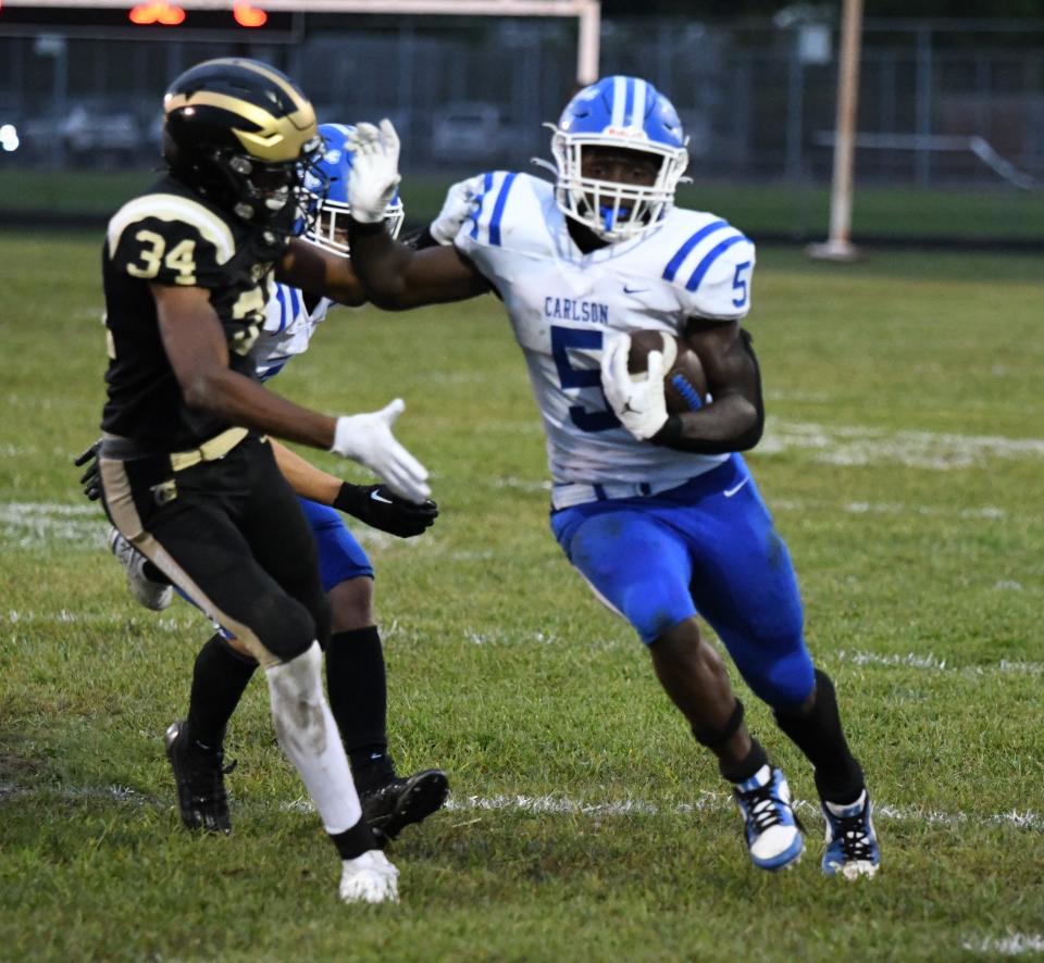 Gibraltar Carlson's Izaiah Wright tries to get past at Taylor defender during a 57-12 Marauder rout Friday night.