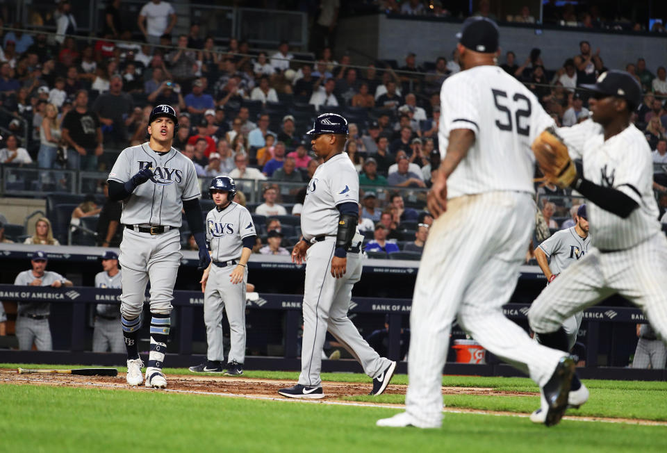 NEW YORK, NEW YORK - JULY 16:  Avisail Garcia #24 of the Tampa Bay Rays has words with CC Sabathia #52 of the New York Yankees after an at bat in the sixth inning during their at Yankee Stadium on July 16, 2019 in New York City. (Photo by Al Bello/Getty Images)