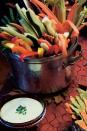 <p>Turn your veggie platter into a centerpiece by cutting raw vegetables into long strips and serving them up in a cauldron-like pot. And of course, no spooky vegetable platter is complete without a slime-green herb dip (that tastes delicious, despite the name!).</p><p>Get the <strong><a href="https://www.womansday.com/food-recipes/food-drinks/a28859236/crude-ites-with-green-slime-dip-recipe/" rel="nofollow noopener" target="_blank" data-ylk="slk:Crude-Ités with Green Slime Dip recipe" class="link ">Crude-Ités with Green Slime Dip recipe</a></strong>.</p>