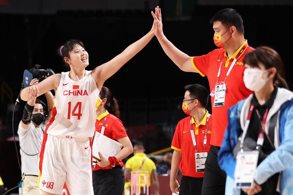 <p>SAITAMA, JAPAN - JULY 30: Yueru Li #14 of Team China high-fives Yao Ming after China defeates Australia in a Women's Basketball Preliminary Round Group C game on day seven of the Tokyo 2020 Olympic Games at Saitama Super Arena on July 30, 2021 in Saitama, Japan. (Photo by Gregory Shamus/Getty Images)</p> 