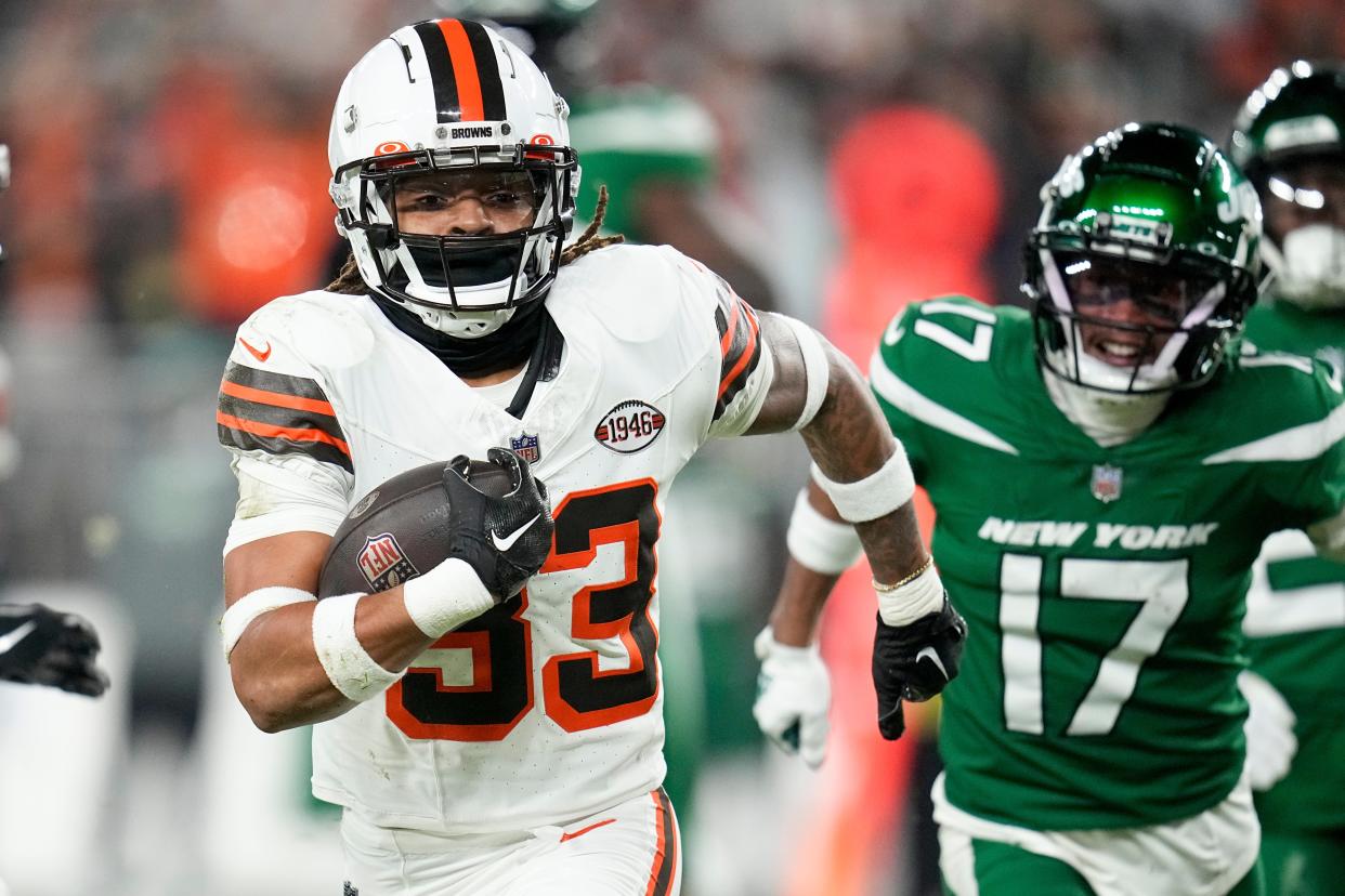 Cleveland Browns safety Ronnie Hickman intercept a pass for a touchdown intended for New York Jets wide receiver Garrett Wilson on Dec. 28, 2023, in Cleveland.
