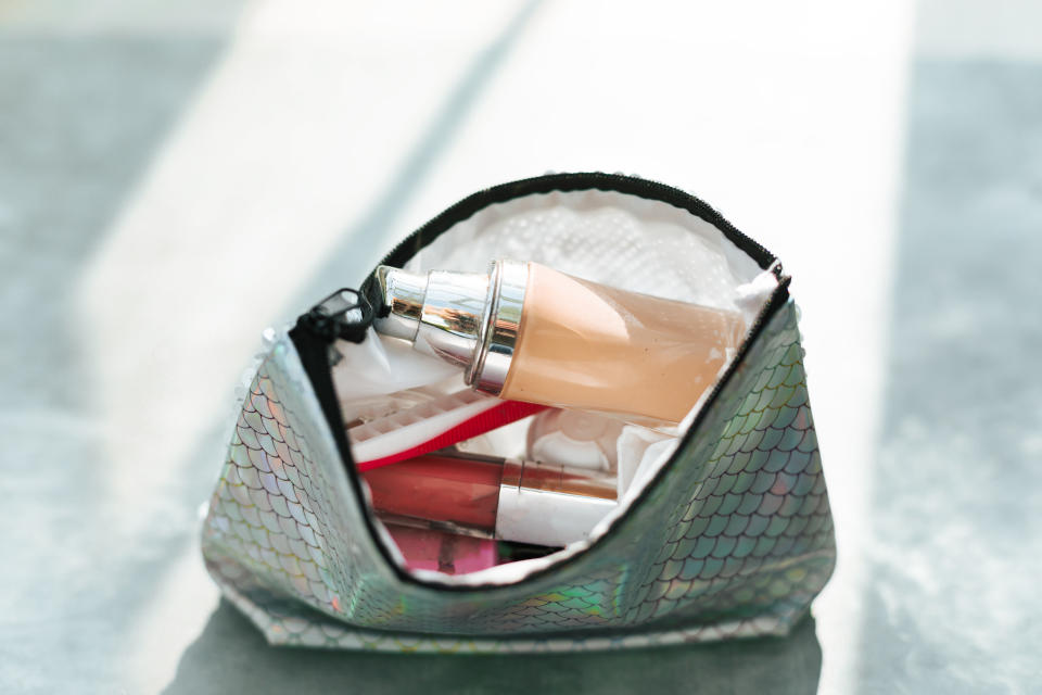 top view cosmetic make-up bag with beauty products