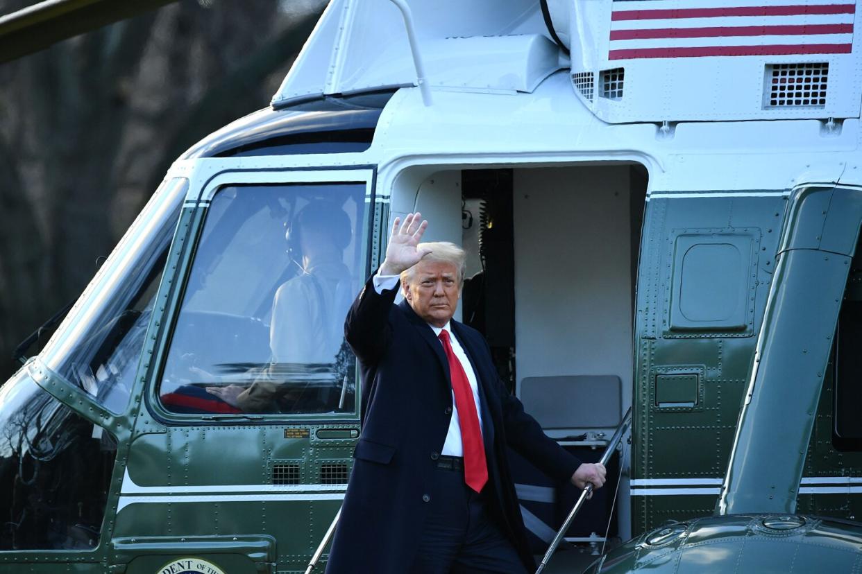 Outgoing US President Donald Trump and First Lady Melania Trump speak to the media depart the White House