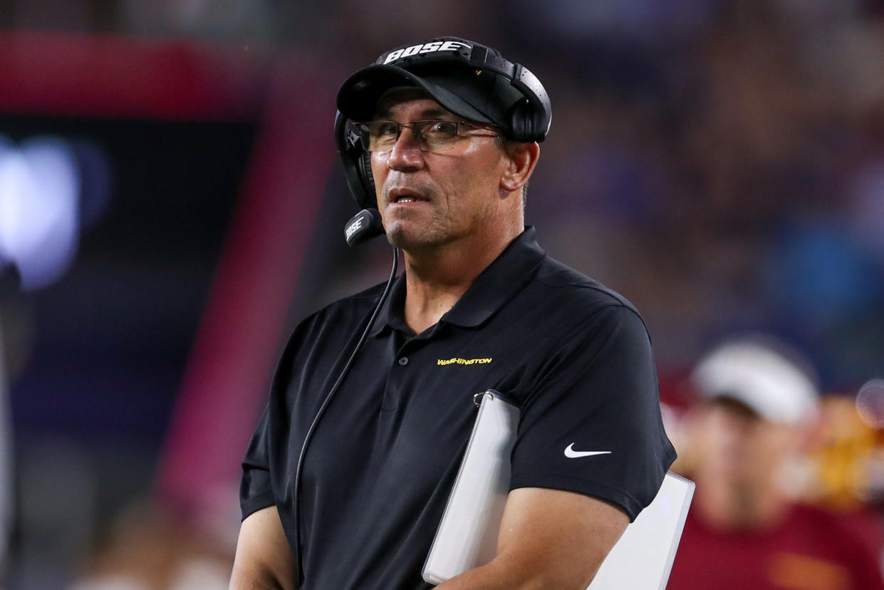 Ron Rivera looks on during the first half against the New England Patriots at Gillette Stadium. 