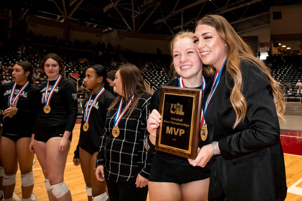 Canyon Randall junior Jordyn Gove (7) poses for a photo with Canyon Randall Head Coach Haleigh Burns after winning the Most Valuable Player award following the UIL 4A State Volleyball Championship game against Aubrey at the Curtis Culwell Center in Garland, Texas on Saturday, Nov. 19, 2022. (Emil Lippe/For The Amarillo Globe-News)