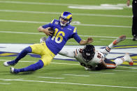 Los Angeles Rams quarterback Jared Goff (16) slides in front of Chicago Bears linebacker James Vaughters (93) during the second half of an NFL football game Monday, Oct. 26, 2020, in Inglewood, Calif. (AP Photo/Ashley Landis)