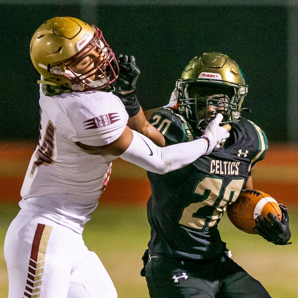 Florida State High #14 Diego Duprey throws a facemark on Trinity Catholic #20 Beau Beard in the first half. Trinity Catholic lost to Florida State University High School 17-12 at Trinity Catholic High School in Ocala, FL., Friday night, November 26, 2021.[Doug Engle/Ocala Star-Banner]2021