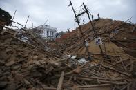 People work to rescue trapped people inside a temple in Bashantapur Durbar Square after the major earthquake hit Kathmandu, Nepal April 25, 2015. REUTERS/Navesh Chitrakar