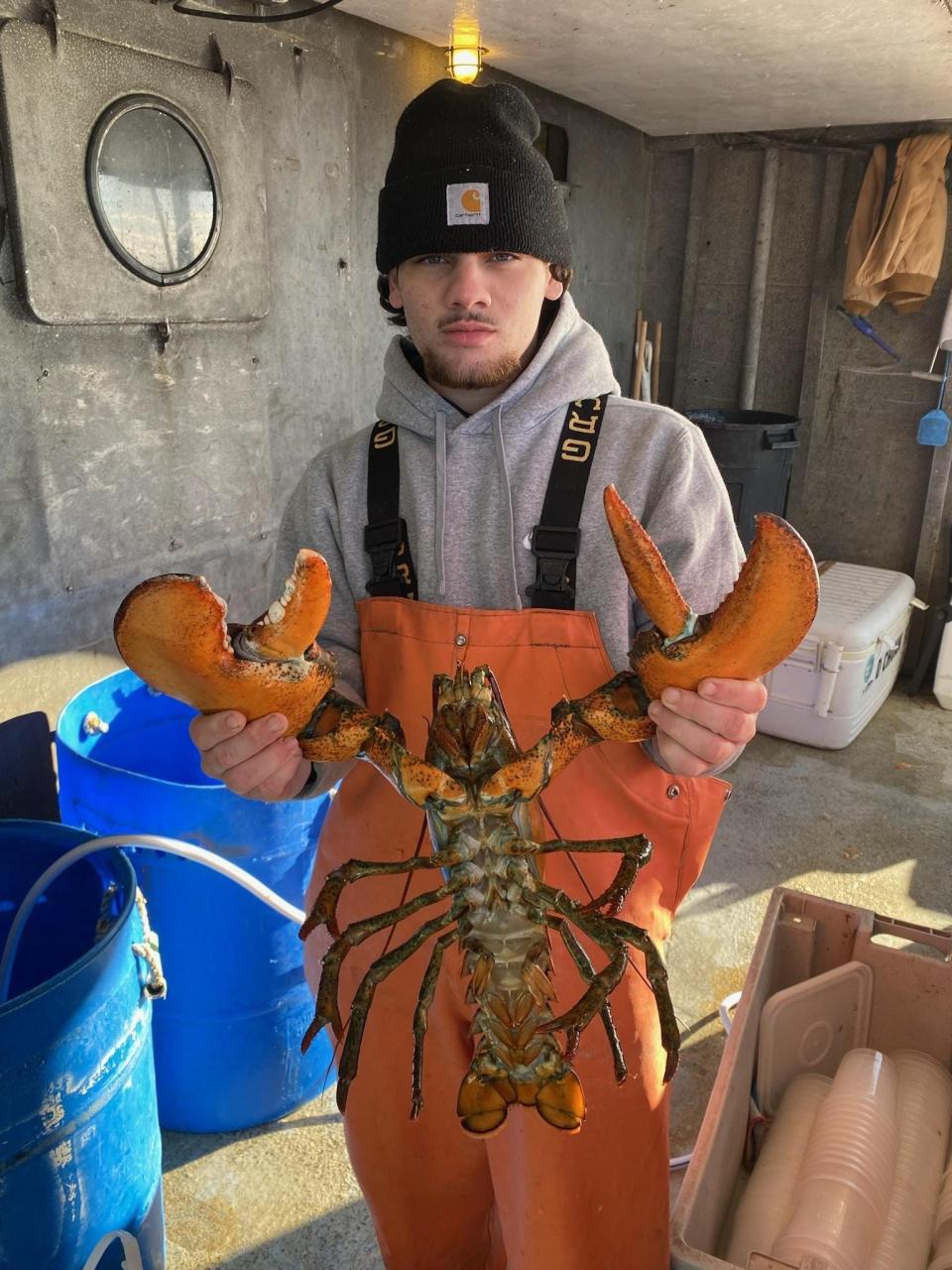 Anthony DeMatteo of Brick, holds a lobster that was landed on the Big Jamaica during an offshore wreck trip.