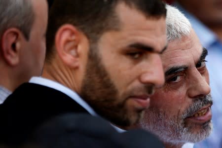 Hamas Gaza Chief Yehya Al-Sinwar looks on as he takes part in a protest against Bahrain's workshop for U.S. Middle East peace plan, in Gaza City