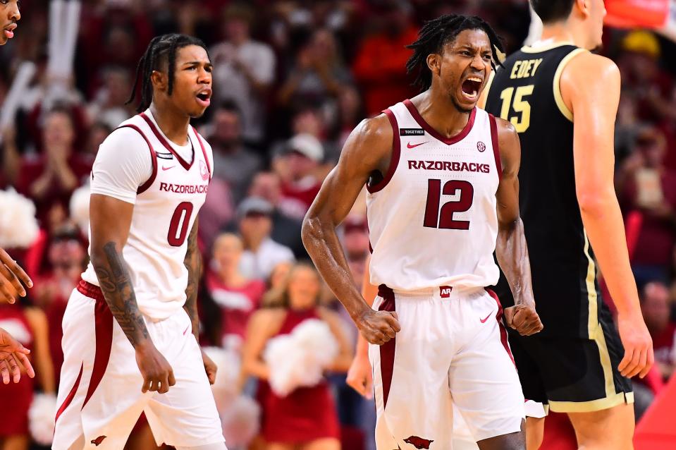 Tramon Mark (12) celebrates after making a three-pointer to force overtime in the Arkansas basketball team's 81-77 exhibition win over Purdue Saturday.