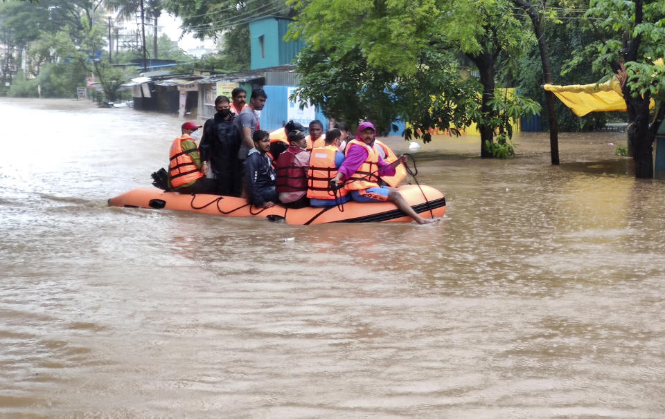 National Disaster Response Force personnel rescue people stranded in floodwaters in Kolhapur, in the western Indian state of Maharashtra, Friday, July 23, 2021. Landslides triggered by heavy monsoon rains hit parts of western India, killing more than 30 people and leading to the overnight rescue of more than 1,000 other people trapped by floodwaters, officials said Friday. (AP Photo)