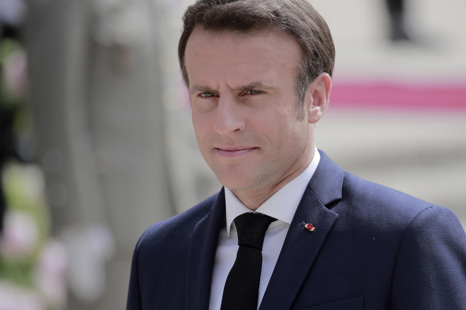 French President Emmanuel Macron reviews military troops during the ceremony of his inauguration for a second term at the Elysee palace, in Paris, France, Saturday, May 7, 2022. Macron was reelected for five years on April 24 in an election runoff that saw him won over far-right rival Marine Le Pen. (AP Photo/Lewis Joly)