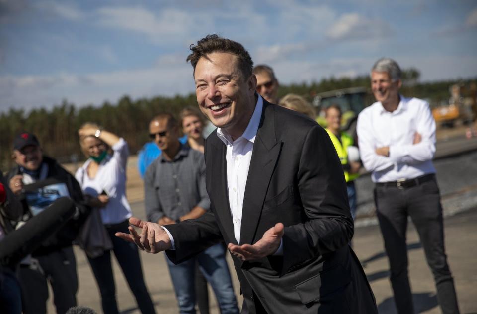 <span class="caption">Tesla CEO Elon Musk, shown at an electric vehicle factory, called ESG ratings 'a scam' after an index dropped Tesla. </span> <span class="attribution"><a class="link " href="https://www.gettyimages.com/detail/news-photo/tesla-head-elon-musk-talks-to-the-press-as-he-arrives-to-to-news-photo/1270402341" rel="nofollow noopener" target="_blank" data-ylk="slk:Maja Hitij/Getty Images;elm:context_link;itc:0;sec:content-canvas">Maja Hitij/Getty Images</a></span>
