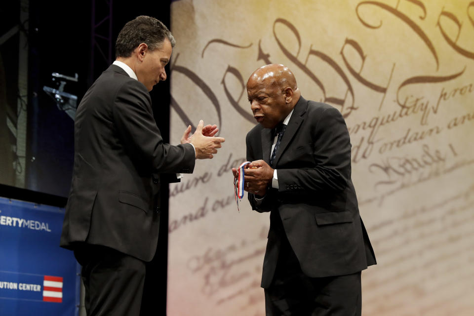 Rep. John Lewis, right, D-Ga., reacts after being presented with the Liberty Medal for his dedication to civil rights from National Constitution Center CEO Jeffrey Rosen during a ceremony on Sept. 19, 2016, in Philadelphia. The honor is given annually to an individual who displays courage and conviction while striving to secure liberty for people worldwide. (Photo: Matt Slocum/AP)