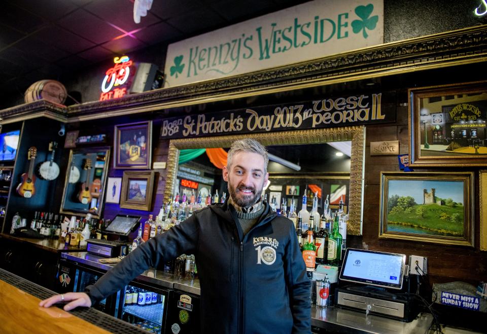 Sean Kenny, founder of Kenny's Westside Pub, stands behind the bar of his popular tavern in downtown Peoria. The Irish-themed bar opened on St. Patrick's Day in 2013 on West Farmington Road before moving to a much larger space in downtown Peoria in 2016.  The business has become a hotspot for live music and is acclaimed for its menu.