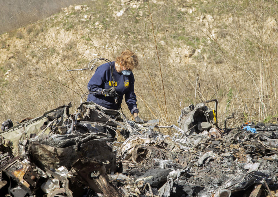 An investigator works at the scene of the helicopter crash on January 27, 2020, in Calabasas, California