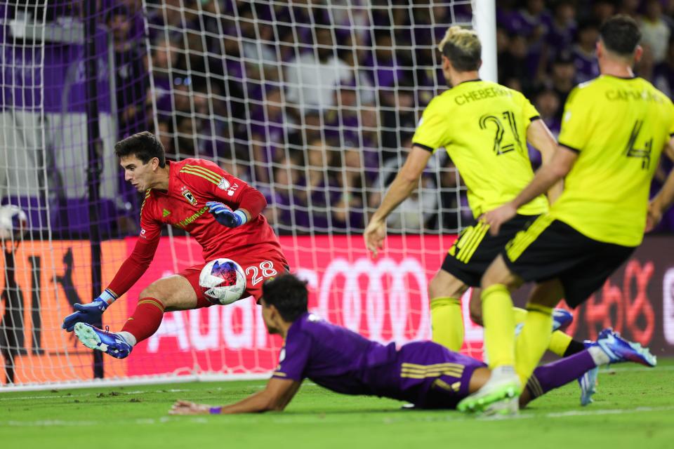 Crew goalkeeper Patrick Schulte makes a save against Orlando City during the second half of extra time Saturday.