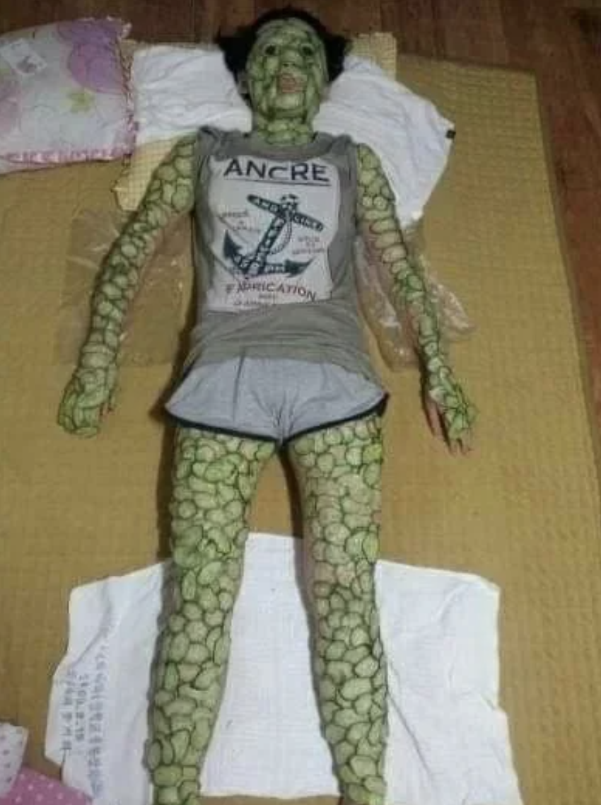 A person made out of cucumbers