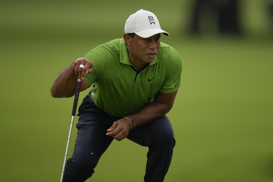 Tiger Woods lines up a putt on the third hole during the second round of the PGA Championship.