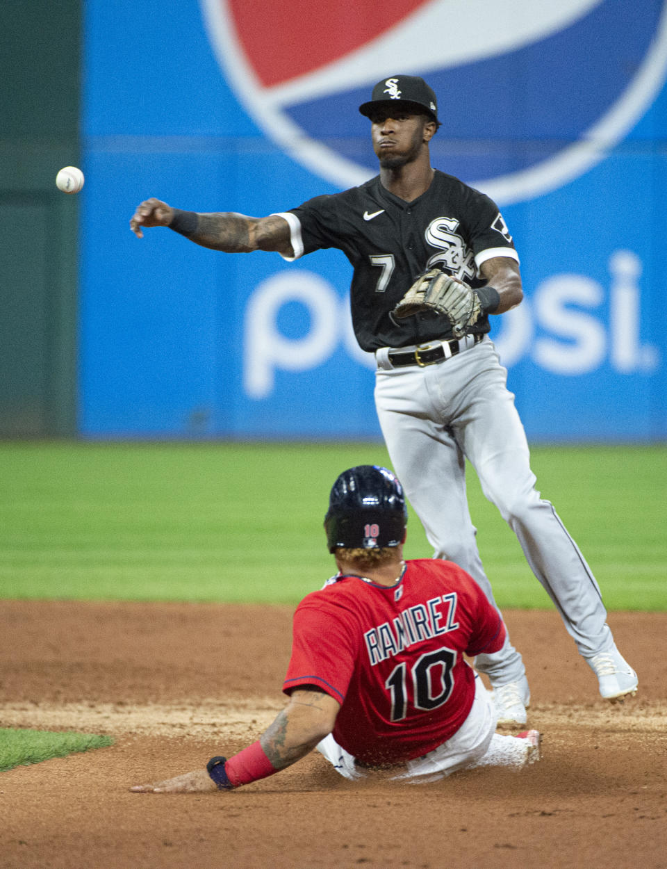 Chicago White Sox's Tim Anderson forces Cleveland Indians' Harold Ramirez at second base and completes a double play by throwing Austin Hedges out at first during the second inning of a baseball game in Cleveland, Saturday, Sept. 25, 2021. (AP Photo/Phil Long)