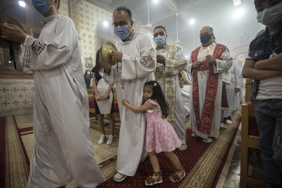 Coptic Orthodox deacon pray during Easter mass, at Holy Cross Church in Cairo, Egypt, Saturday, May 1, 2021. Orthodox Christians around the world celebrate Easter on Sunday, May 2. (AP Photo/Nariman El-Mofty)
