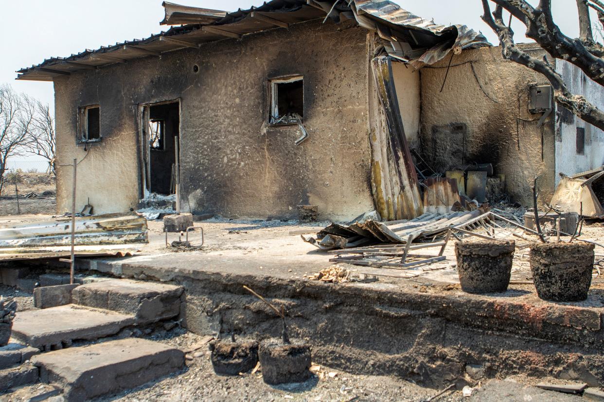 A destroyed house as a wildfire burns in the village of Kiotari, on the island of Rhodes (REUTERS)