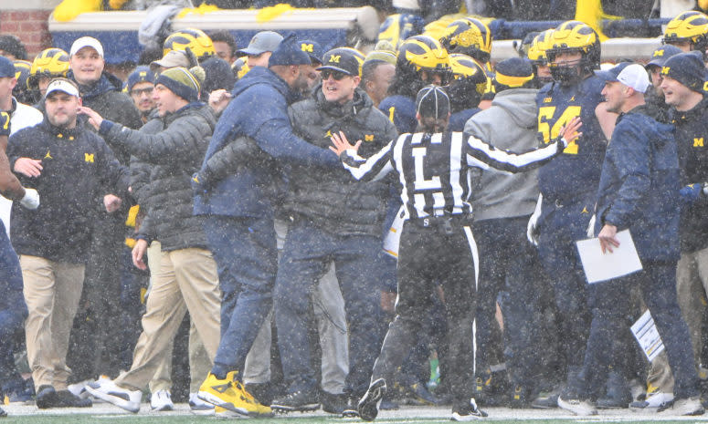 Michigan head coach Jim Harbaugh celebrates his win over Ohio State.