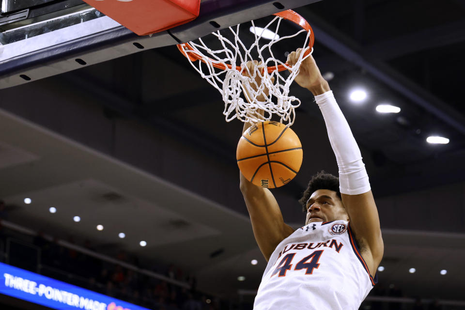 Auburn center Dylan Cardwell dunks against Penn during the second half of an NCAA college basketball game Tuesday, Jan. 2, 2024, in Auburn, Ala. (AP Photo/Butch Dill)