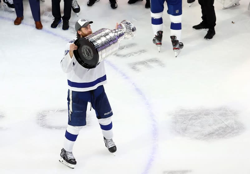 EDMONTON, ALBERTA - SEPTEMBER 28: Victor Hedman #77 of the Tampa Bay Lightning skates with the Stanley Cup following the series-winning victory over the Dallas Stars in Game Six of the 2020 NHL Stanley Cup Final at Rogers Place on September 28, 2020 in Edmonton, Alberta, Canada. (Photo by Bruce Bennett/Getty Images)