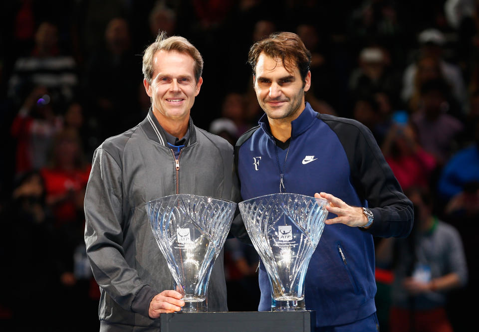 Roger Federer smiles with former coach Stefan Edberg.