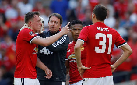 Soccer Football - FA Cup Final - Chelsea vs Manchester United - Wembley Stadium, London, Britain - May 19, 2018 Manchester United's Phil Jones receives medical attention Action Images via Reuters/Andrew Couldridge