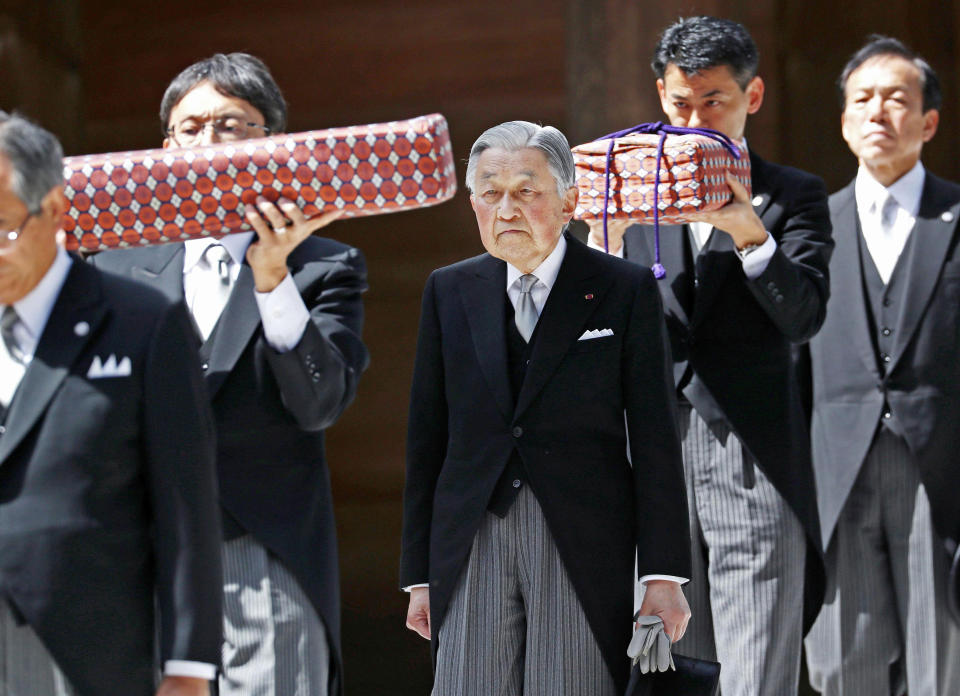 FILE - In this April 18, 2019, photo, Japanese Emperor Akihito, center, visits Ise Grand Shrine, or Ise Jingu, in Ise, central Japan. This is the last trip to a local region for emperor and empress before emperor's abdication. On May 1, 2019, when Crown Prince Naruhito becomes the new emperor. Naruhito will receive a much more important inheritance: The deep respect and affection his father, soon-to-abdicate Emperor Akihito, has accumulated over his three-decade reign.(Kyodo News via AP)