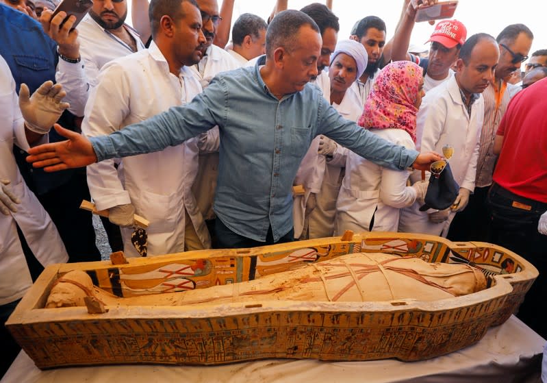 A mummy is seen inside a painted coffin discovered at Al-Asasif Necropolis in the Vally of Kings in Luxor