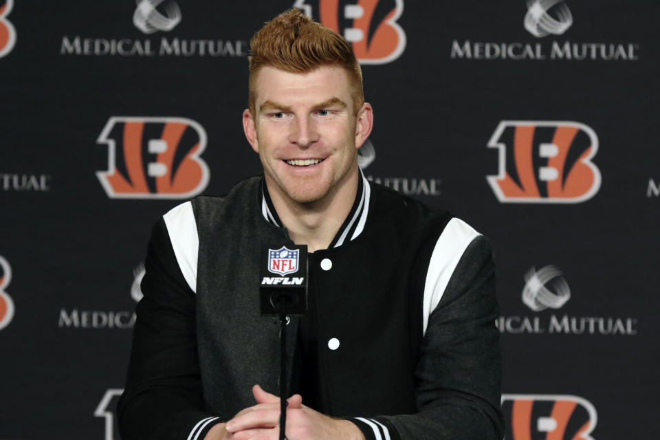 FILE - In this Dec. 29, 2019, file photo, Cincinnati Bengals quarterback Andy Dalton answers questions after his team defeated the Cleveland Browns in an NFL football game in Cincinnati. Dalton is coming home to Texas as Dak Prescott's backup with the Dallas Cowboys. Dalton and the Cowboys agreed to a one-year deal that guarantees the former Cincinnati starter $3 million and could be worth up to $7 million, two people with direct knowledge of the deal told The Associated Press on Saturday, May 2, 2020. (AP Photo/Gary Landers, File)