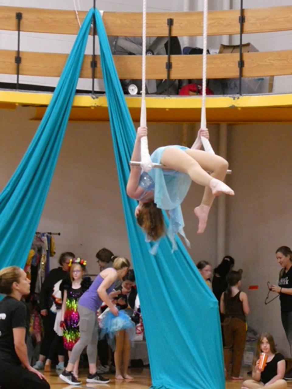 A performer on a trapeze.