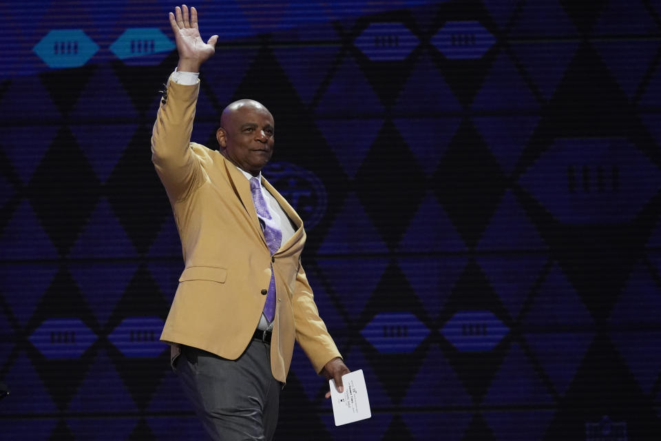 Former player Warren Moon walks on stage to announce a pick for the Tennessee Titans during the second round of the NFL football draft, Friday, April 26, 2024, in Detroit. (AP Photo/Jeff Roberson)