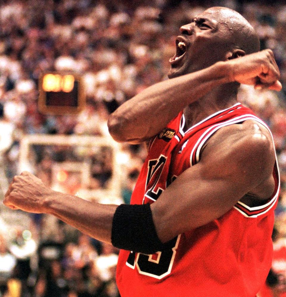 Michael Jordan of the Chicago Bulls celebrates after winning game six of the NBA Finals.